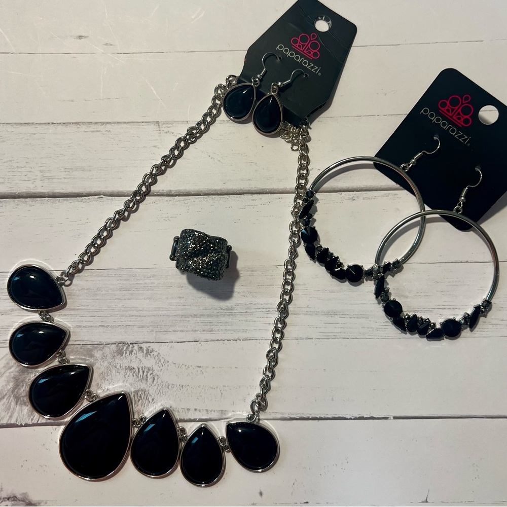 Complete black set: Necklace, (2) pair of earrings and ring.